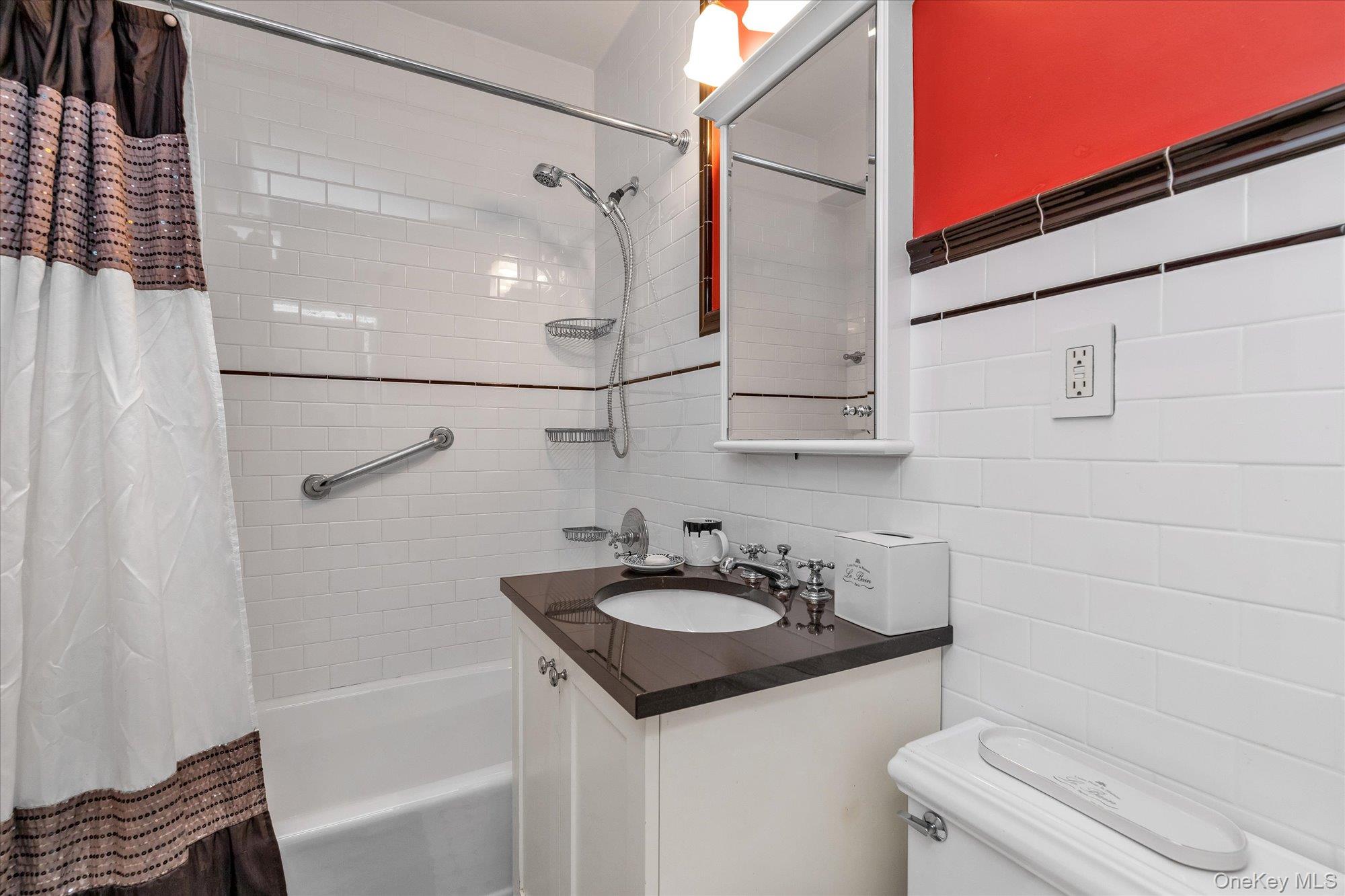 17-85 215th Street, Unit 17E Queens, NY 11360 - Photo 15 of 33 a bathroom with a sink toilet and shower