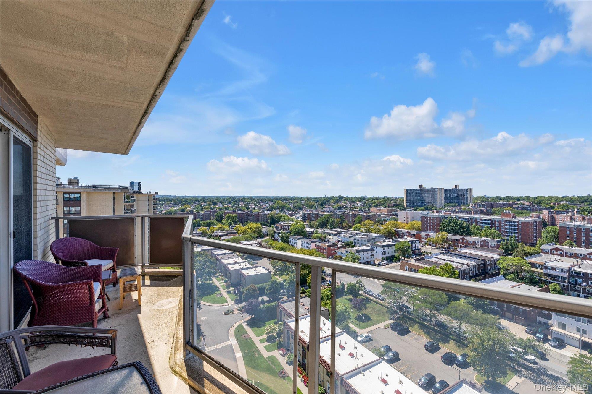 17-85 215th Street, Unit 17E Queens, NY 11360 - Photo 19 of 33 a view of a balcony with a chairs