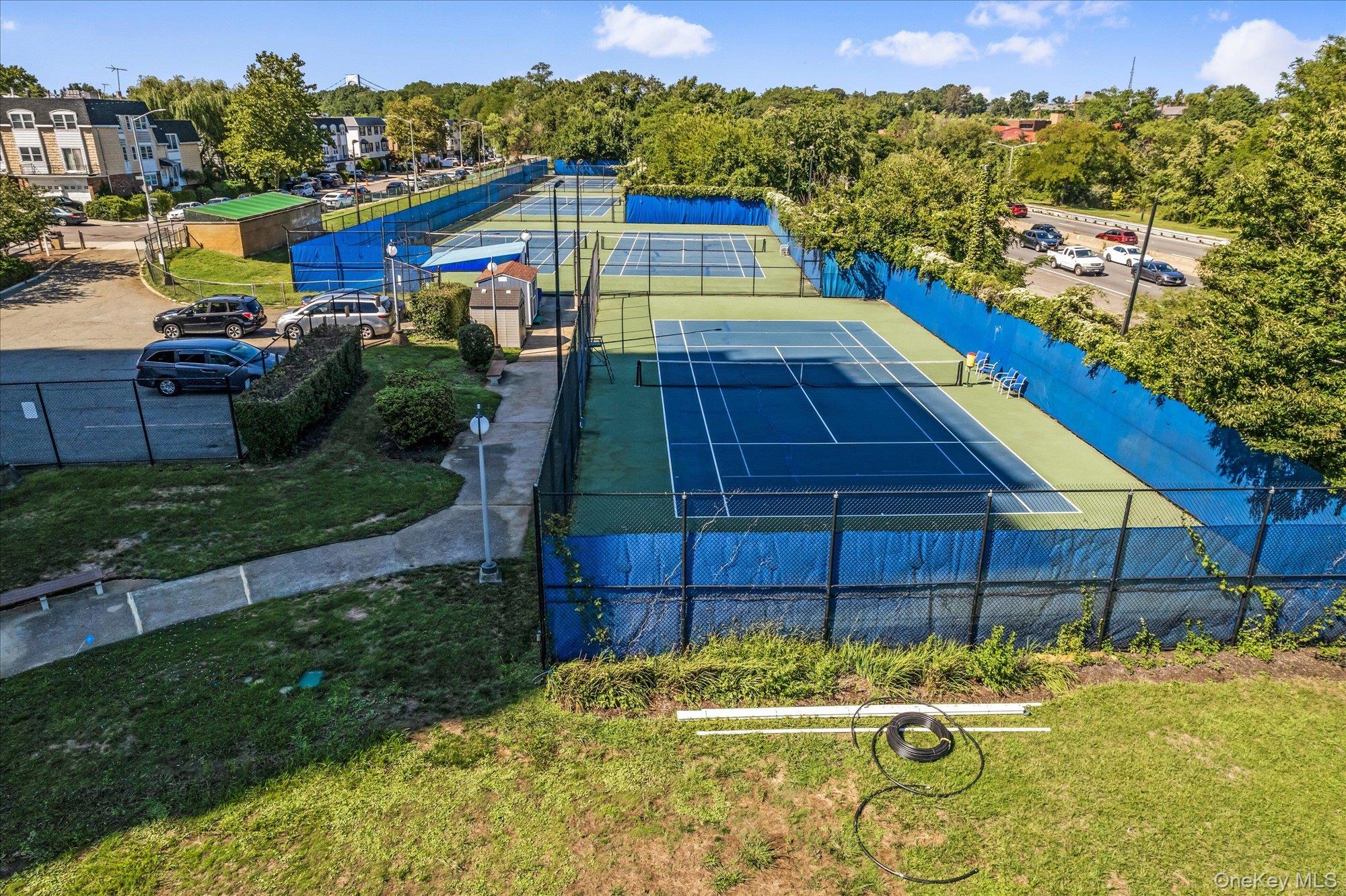 17-85 215th Street, Unit 17E Queens, NY 11360 - Photo 26 of 33 a view of a house with a yard