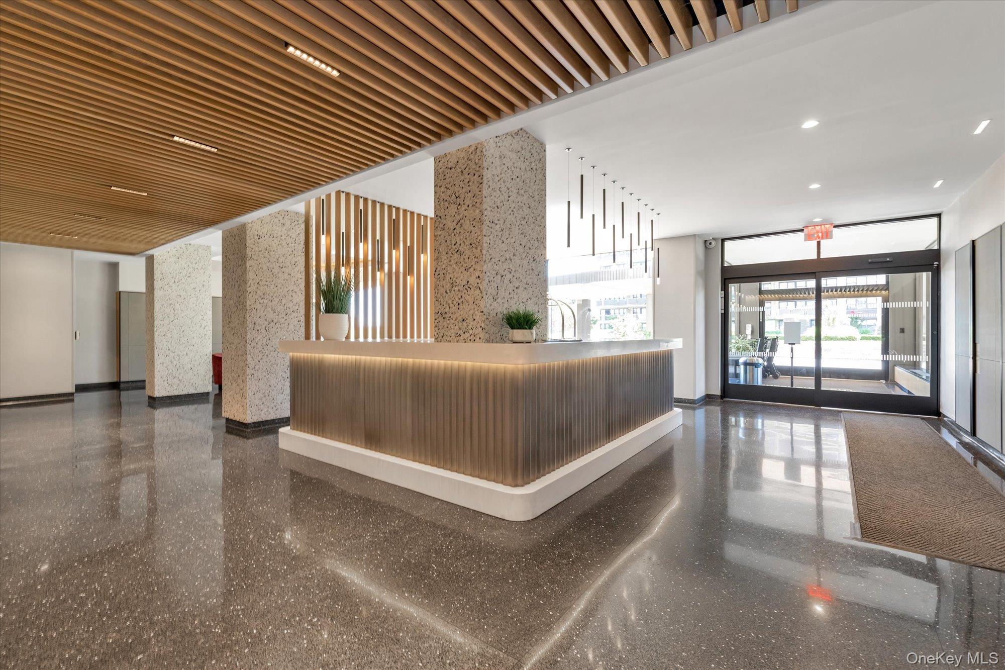 17-85 215th Street, Unit 17E Queens, NY 11360 - Photo 4 of 33 a view of a livingroom with furniture and staircase