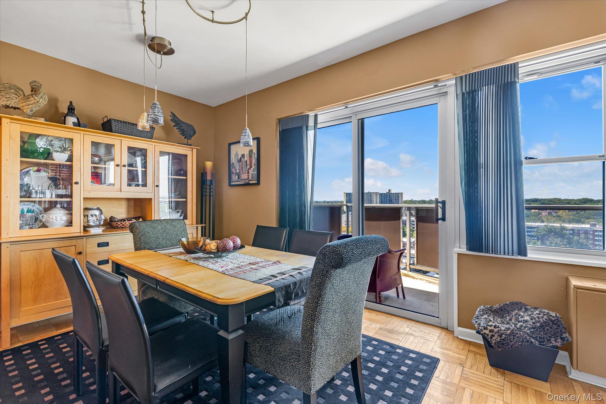 17-85 215th Street, Unit 17E Queens, NY 11360 - Photo 9 of 33 a view of a dining room with furniture window and wooden floor