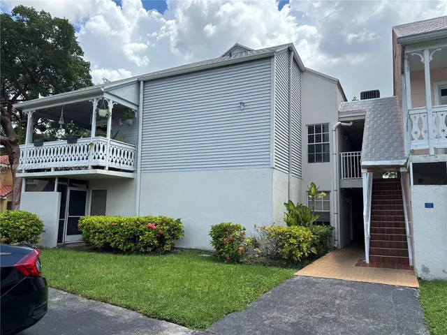 a house view with a garden space