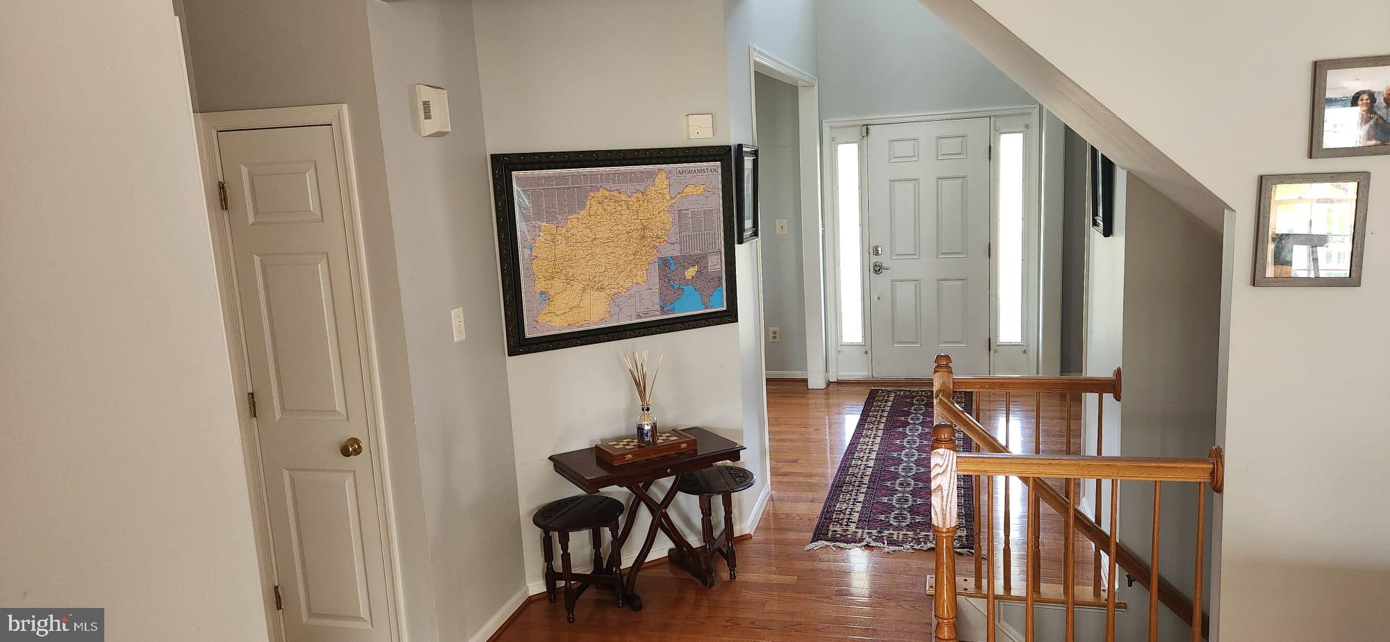 9871 Upper Mill Loop Bristow, VA 20136 - Photo 3 of 84 a view of a livingroom with furniture and hardwood floor