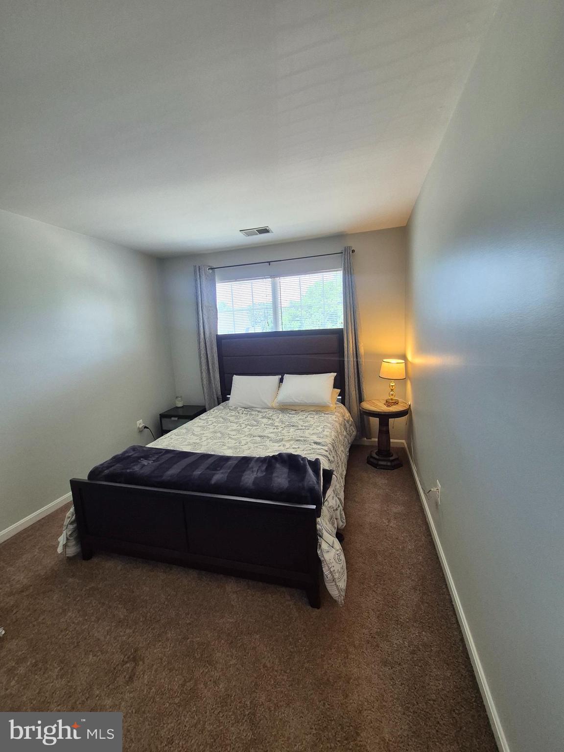 9871 Upper Mill Loop Bristow, VA 20136 - Photo 31 of 84 a bedroom with a bed and window