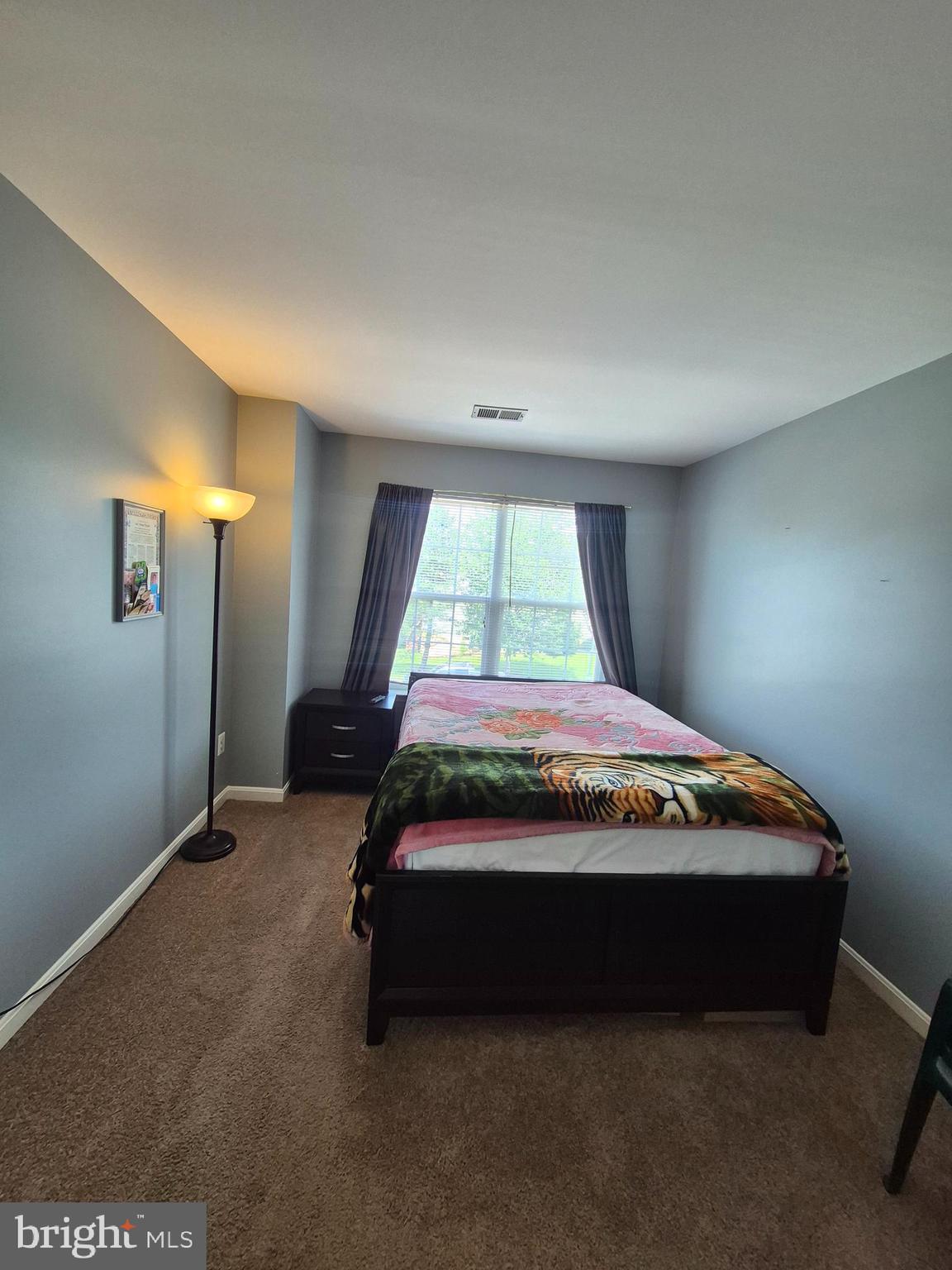 9871 Upper Mill Loop Bristow, VA 20136 - Photo 34 of 84 a bedroom with a bed and window