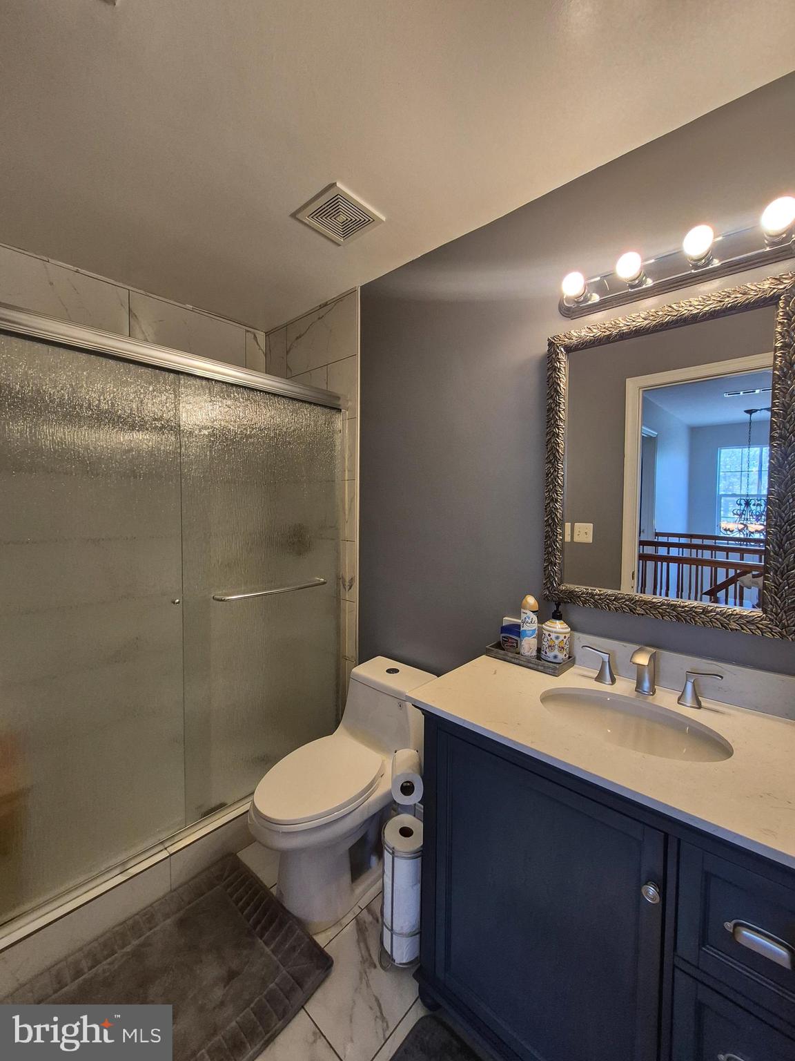 9871 Upper Mill Loop Bristow, VA 20136 - Photo 36 of 84 a bathroom with a sink toilet and shower