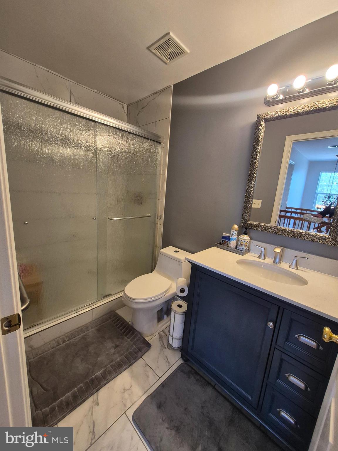 9871 Upper Mill Loop Bristow, VA 20136 - Photo 39 of 84 a bathroom with a sink toilet and shower