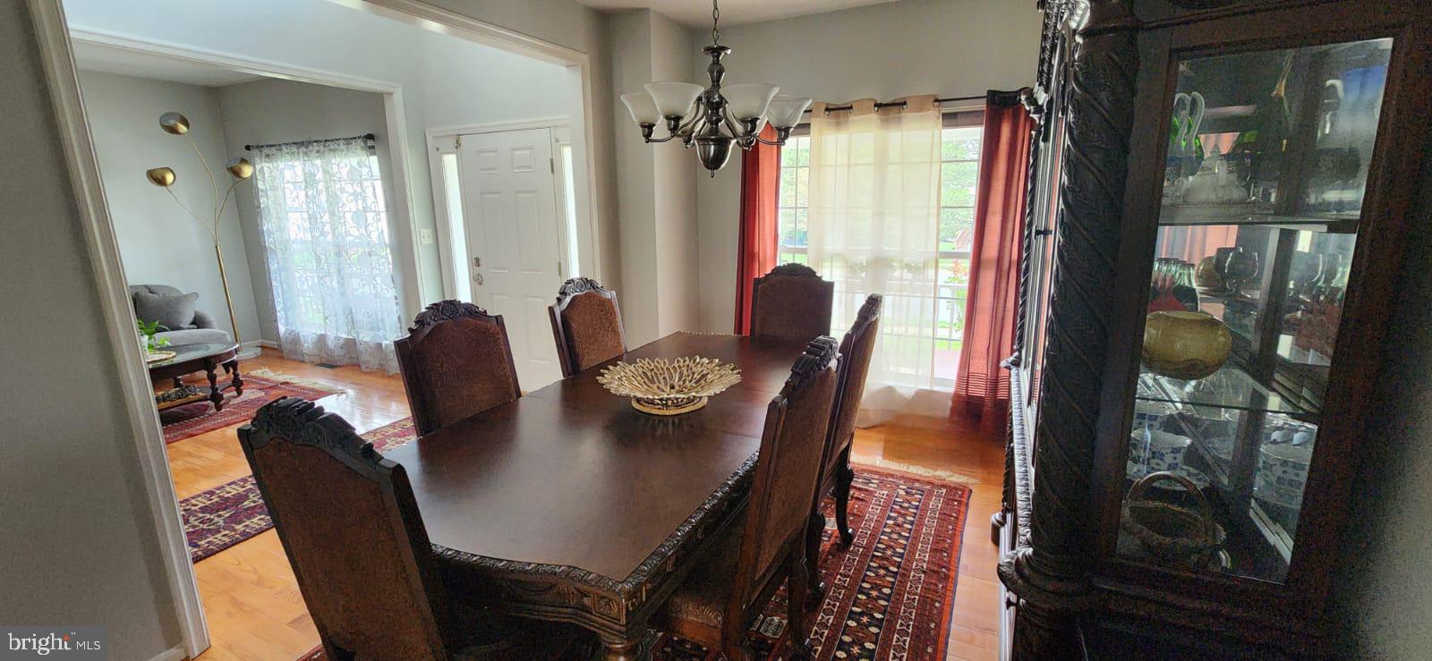 9871 Upper Mill Loop Bristow, VA 20136 - Photo 5 of 84 a view of a dining room with furniture and window