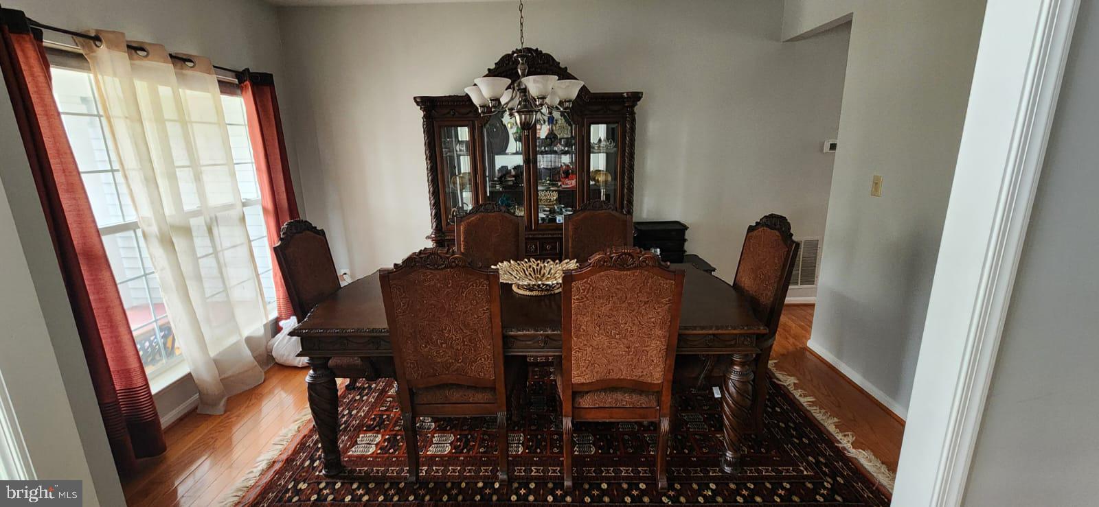 9871 Upper Mill Loop Bristow, VA 20136 - Photo 6 of 84 a view of a dining room with furniture and window