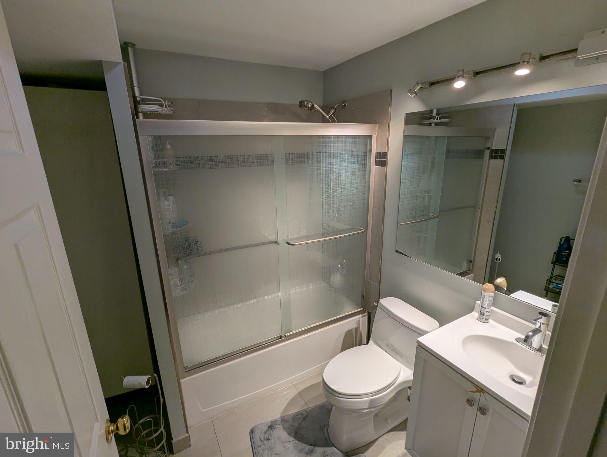 9871 Upper Mill Loop Bristow, VA 20136 - Photo 65 of 84 a bathroom with a sink toilet and shower