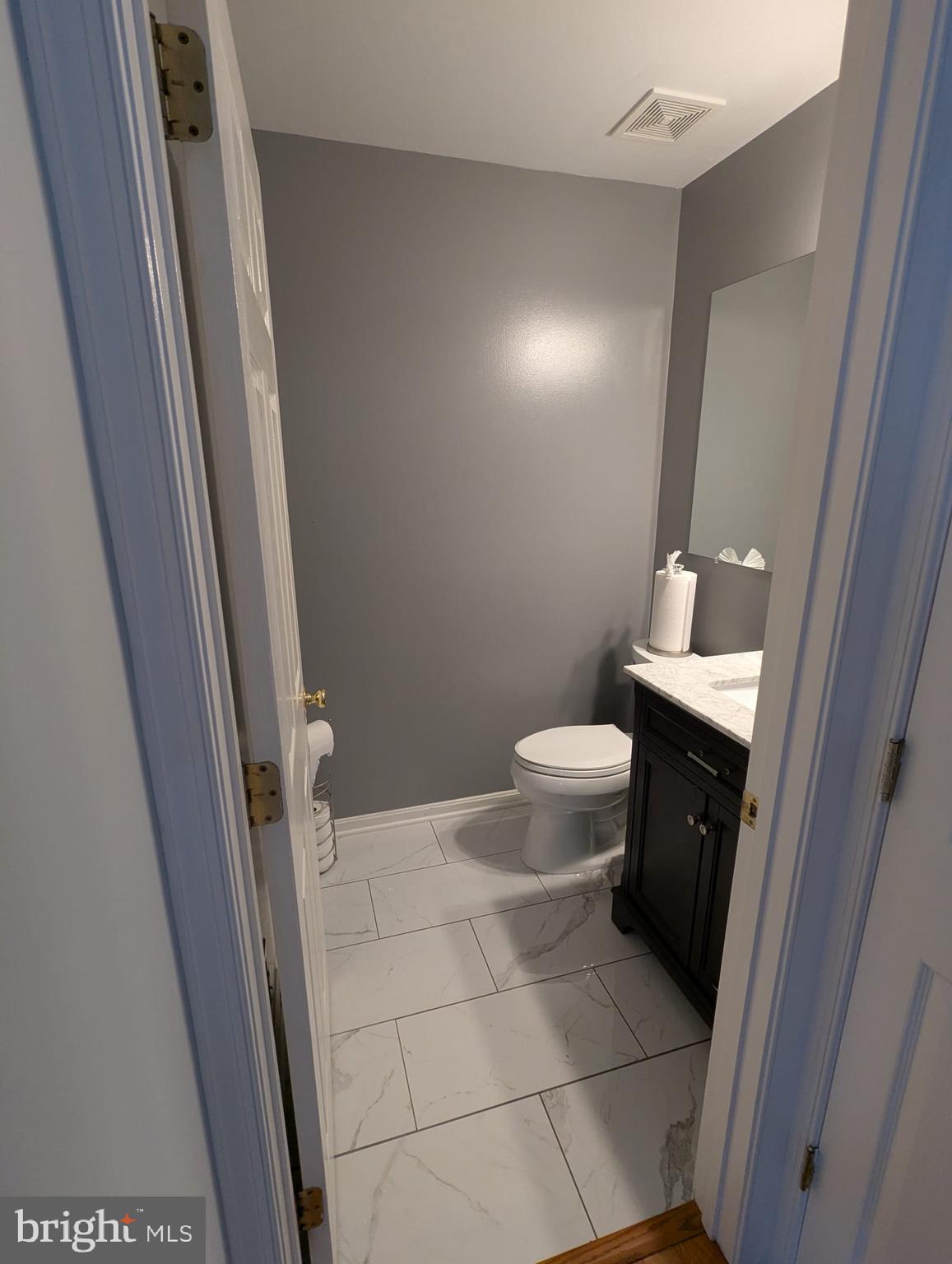 9871 Upper Mill Loop Bristow, VA 20136 - Photo 66 of 84 a bathroom with a toilet and a sink