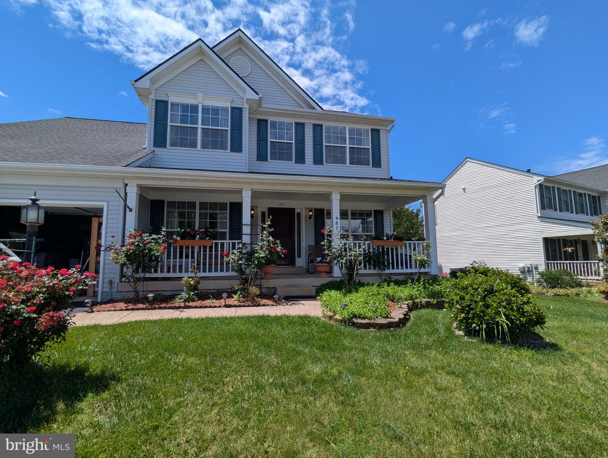 9871 Upper Mill Loop Bristow, VA 20136 - Photo 71 of 84 a view of a house with chair and garden