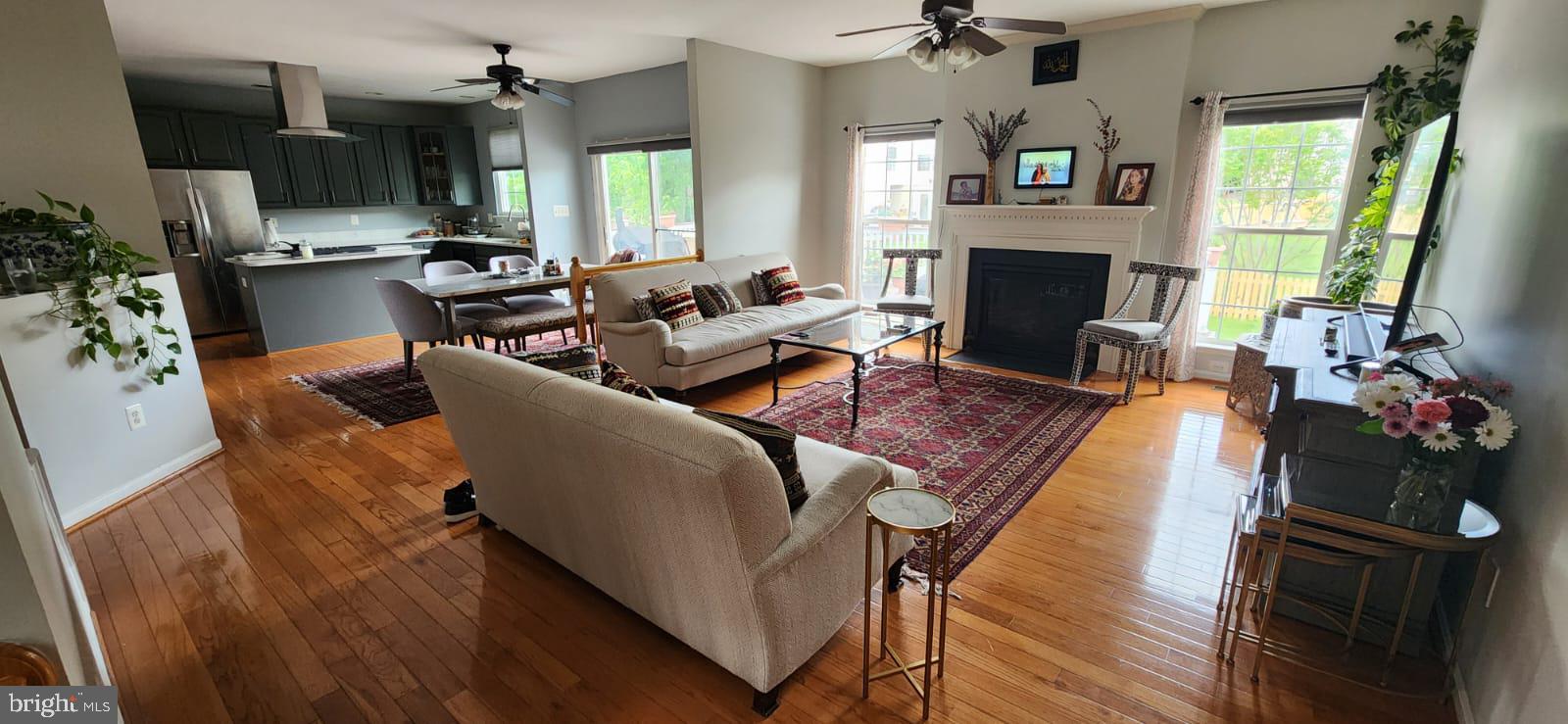 9871 Upper Mill Loop Bristow, VA 20136 - Photo 9 of 84 a living room with furniture fireplace and a flat screen tv
