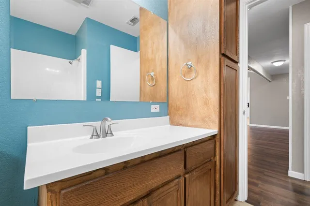 a bathroom with a sink and a mirror
