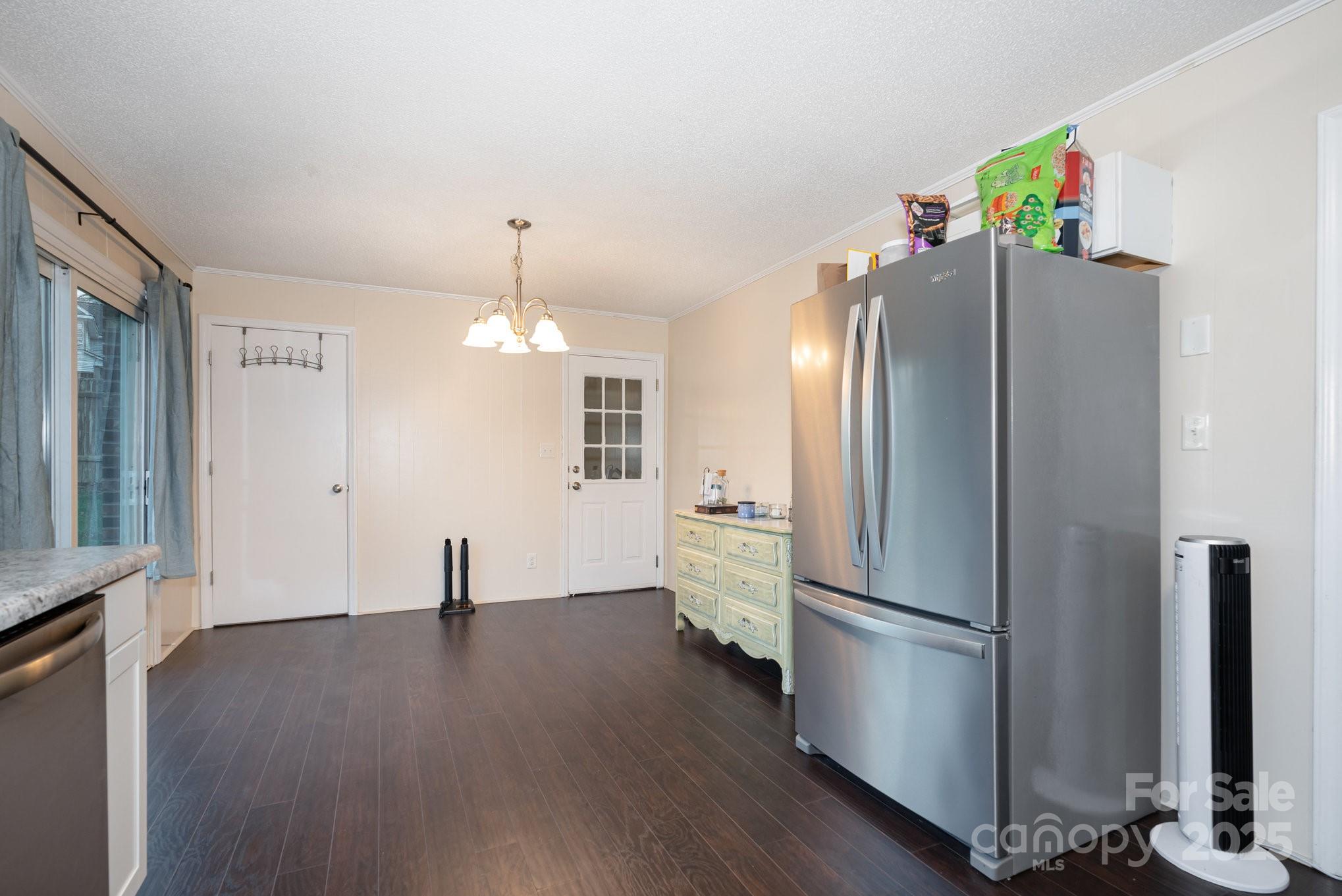 512 Ralphs Boulevard Gastonia, NC 28052 - Photo 13 of 32 a view of a refrigerator in kitchen and wooden floor