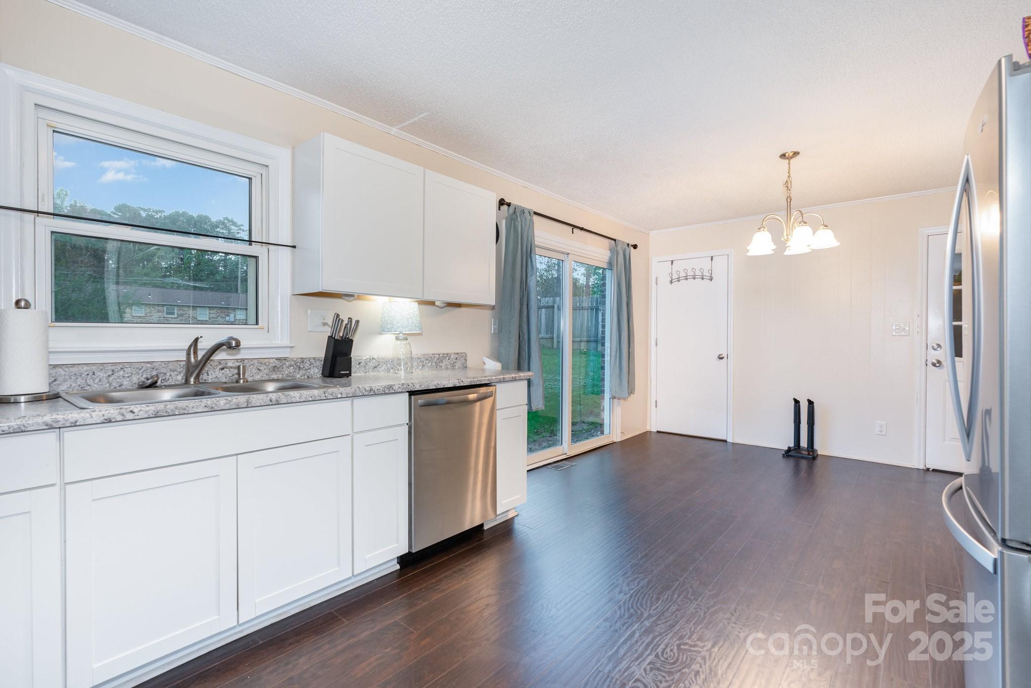 512 Ralphs Boulevard Gastonia, NC 28052 - Photo 14 of 32 a bathroom with granite countertop a sink and a window