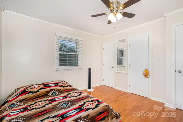 a bedroom with bed and a window