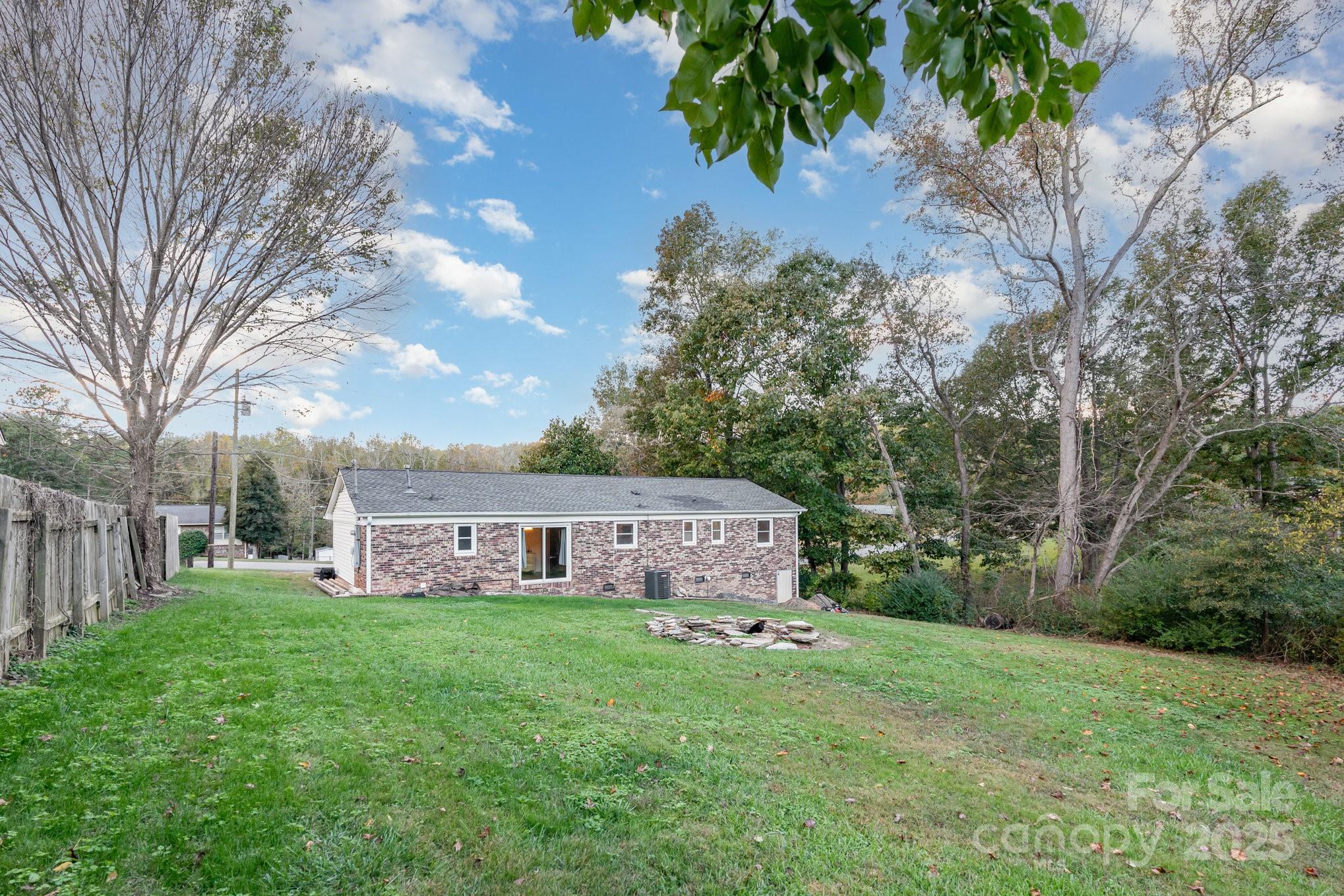 512 Ralphs Boulevard Gastonia, NC 28052 - Photo 26 of 32 a view of a house with backyard and a sitting area