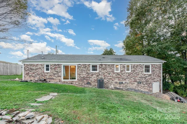 a view of house with yard