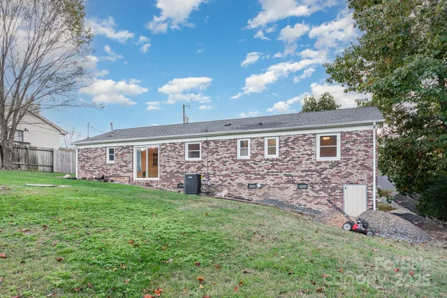 a view of a field of grass and trees