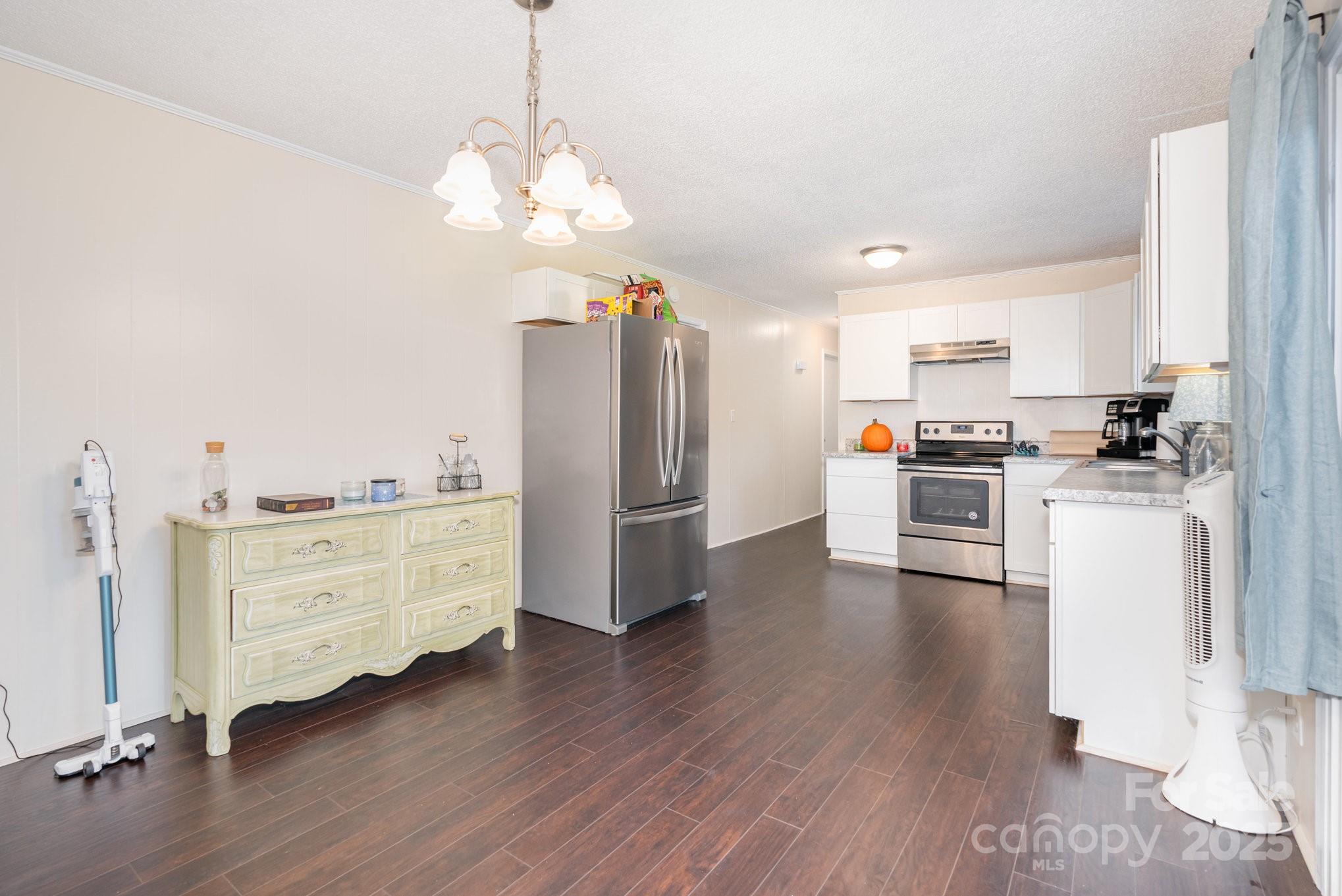 512 Ralphs Boulevard Gastonia, NC 28052 - Photo 7 of 32 a kitchen with stainless steel appliances a refrigerator sink and cabinets