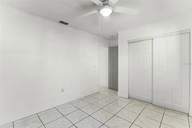 a view of a kitchen with an entryway and a stove top oven