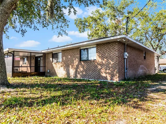 a view of a backyard with a tub and stove