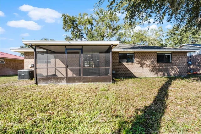 an aerial view of residential houses with outdoor space and seating