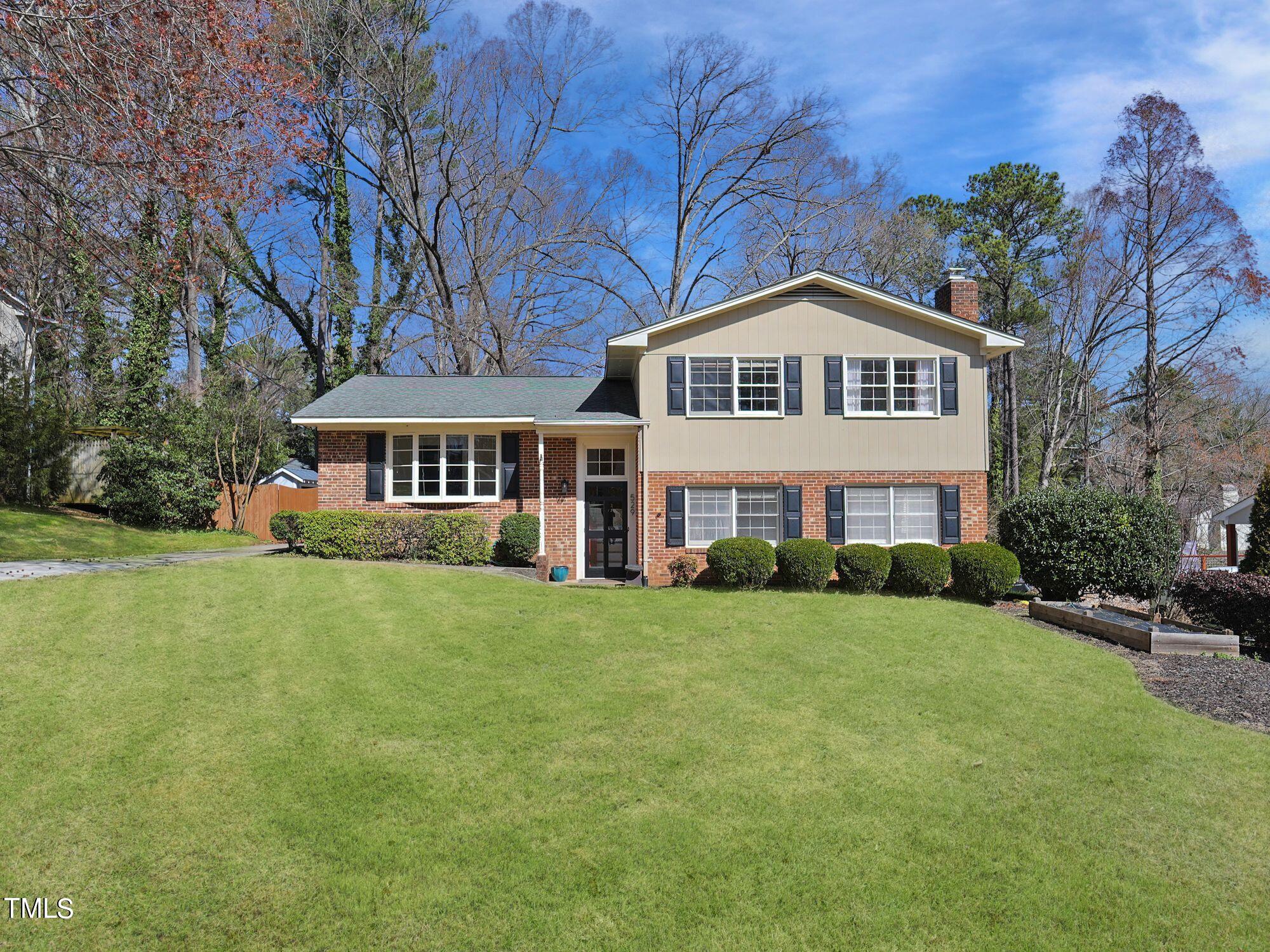 529 Harvard Street Raleigh, NC 27609 - Photo 1 of 48 a front view of a house with a garden