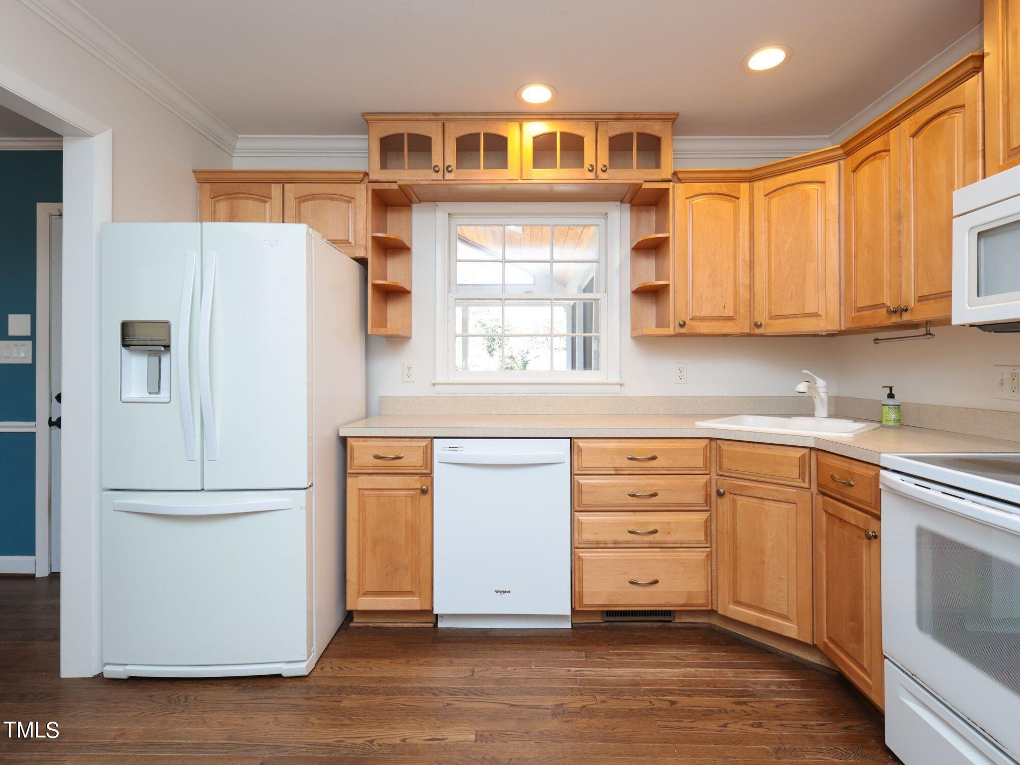 529 Harvard Street Raleigh, NC 27609 - Photo 14 of 48 a kitchen with stainless steel appliances granite countertop a refrigerator and a stove top oven