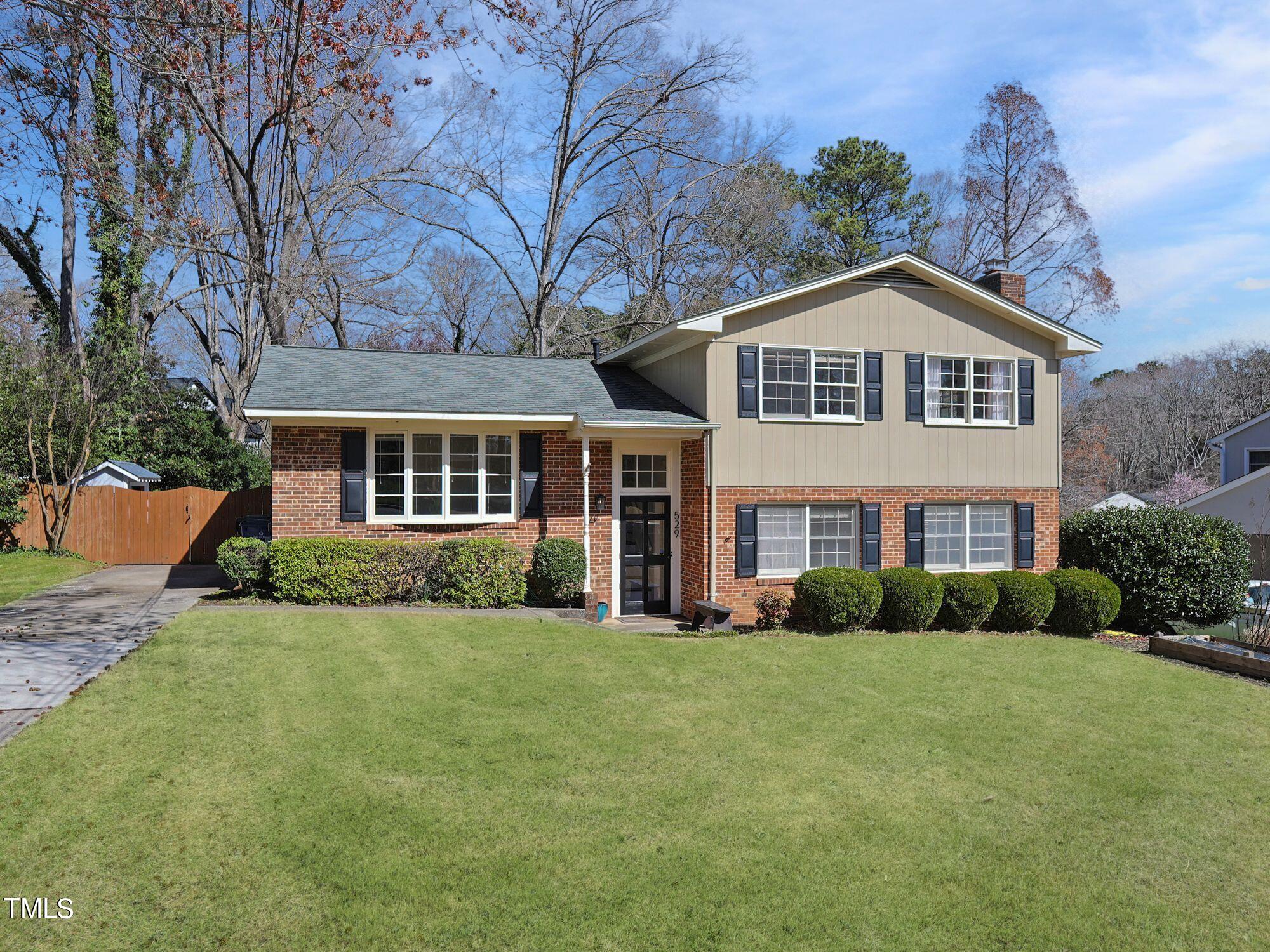 529 Harvard Street Raleigh, NC 27609 - Photo 2 of 48 a front view of a house with a yard