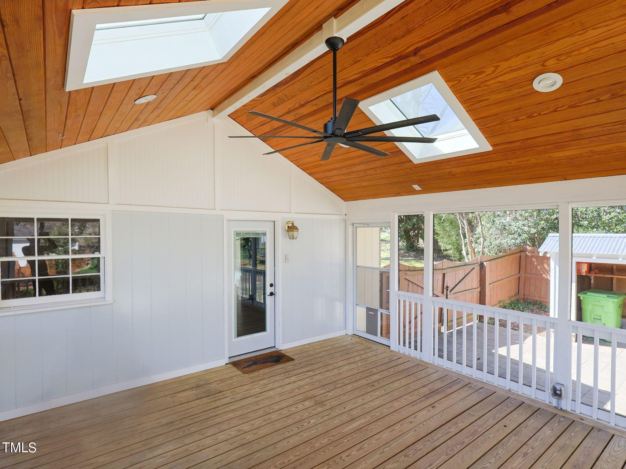 529 Harvard Street Raleigh, NC 27609 - Photo 39 of 48 a view of backyard with a deck and wooden floor