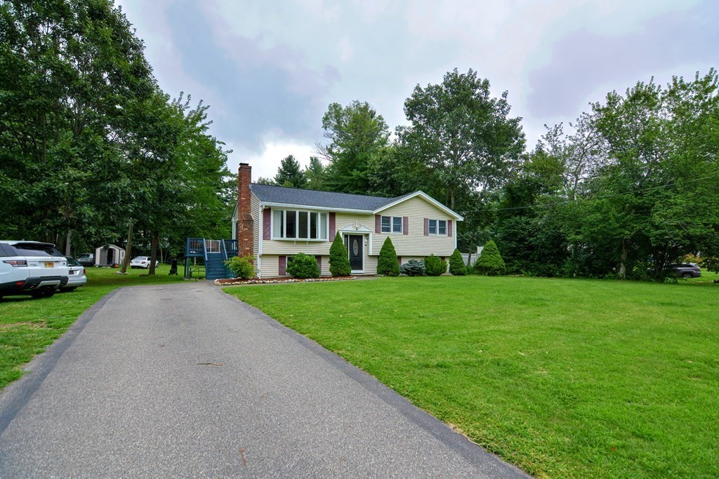 30 Whittier Road Billerica, MA 01821 - Photo 2 of 38 a front view of a house with yard