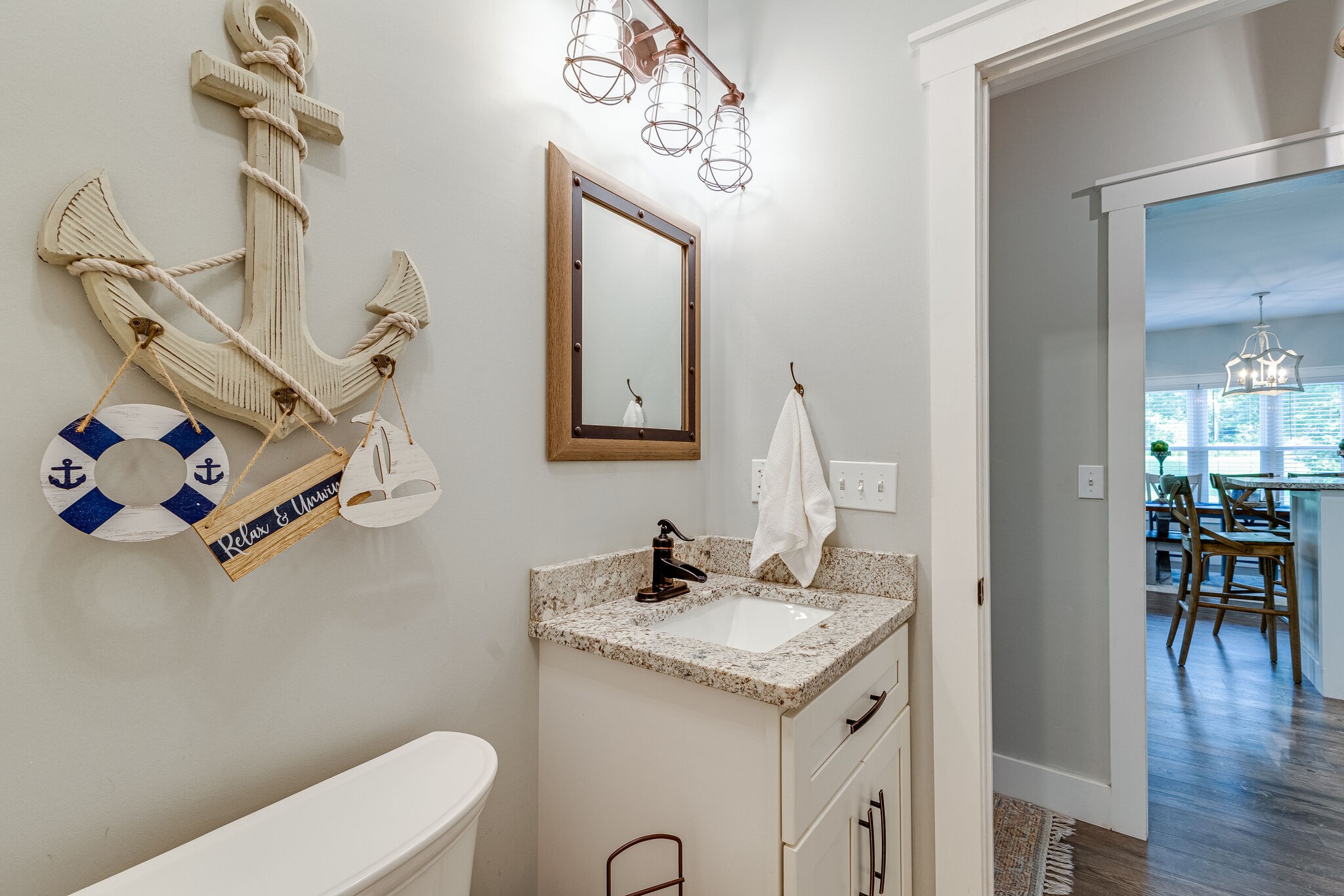 3425 Toms Creek Road Linden, TN 37096 - Photo 14 of 38 a bathroom with a granite countertop sink a toilet and a mirror