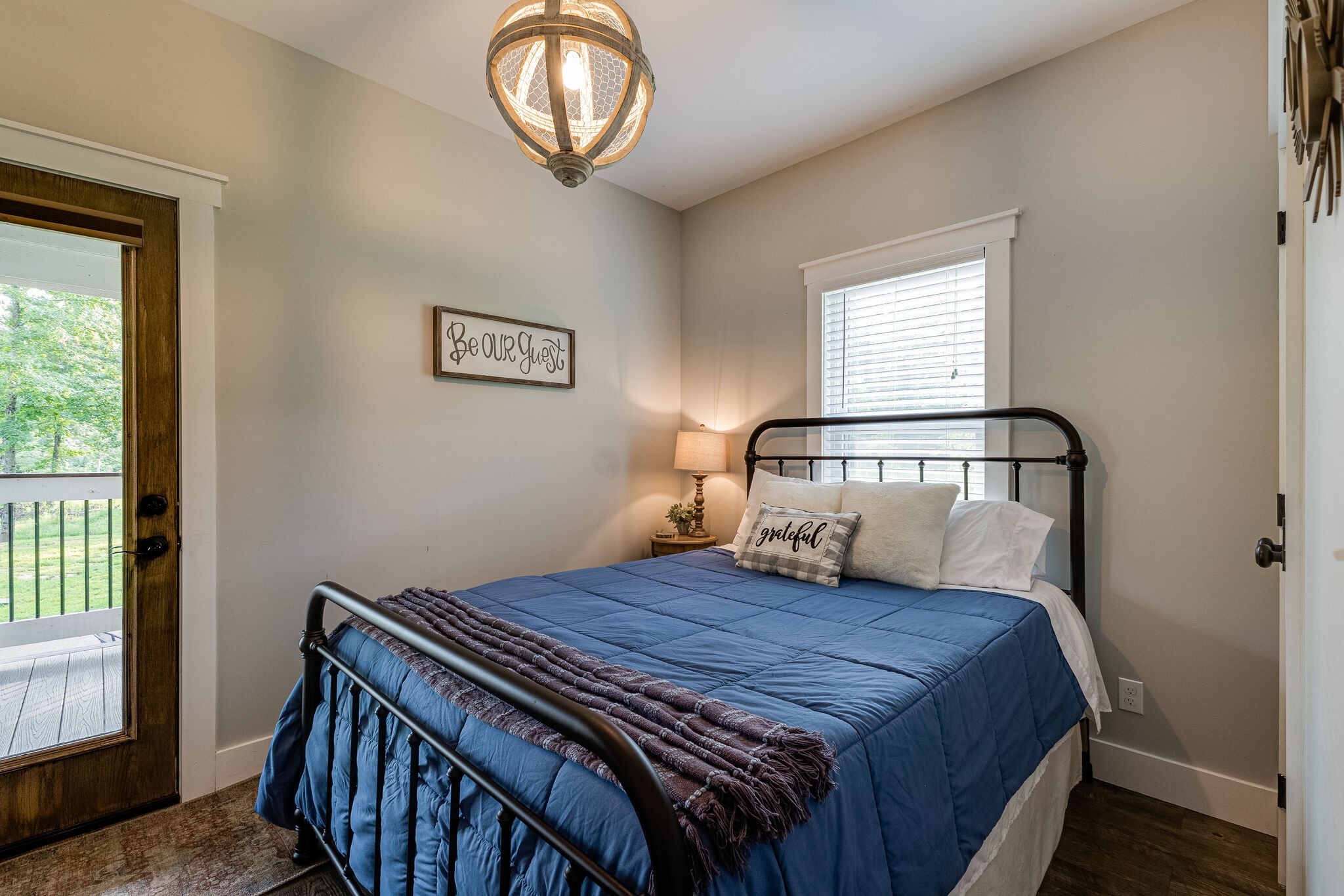 3425 Toms Creek Road Linden, TN 37096 - Photo 18 of 38 a bedroom with a bed and wooden floor