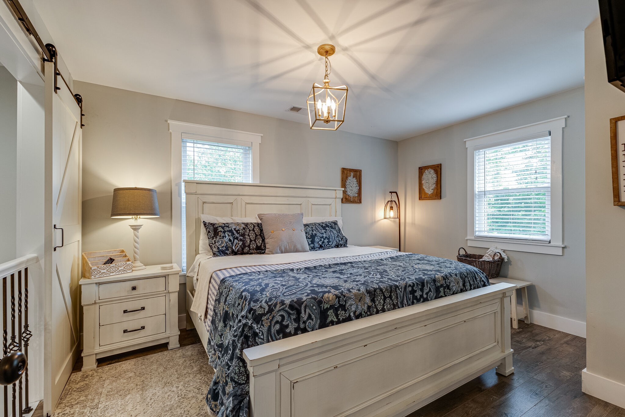 3425 Toms Creek Road Linden, TN 37096 - Photo 20 of 38 a bedroom with a bed and a chandelier