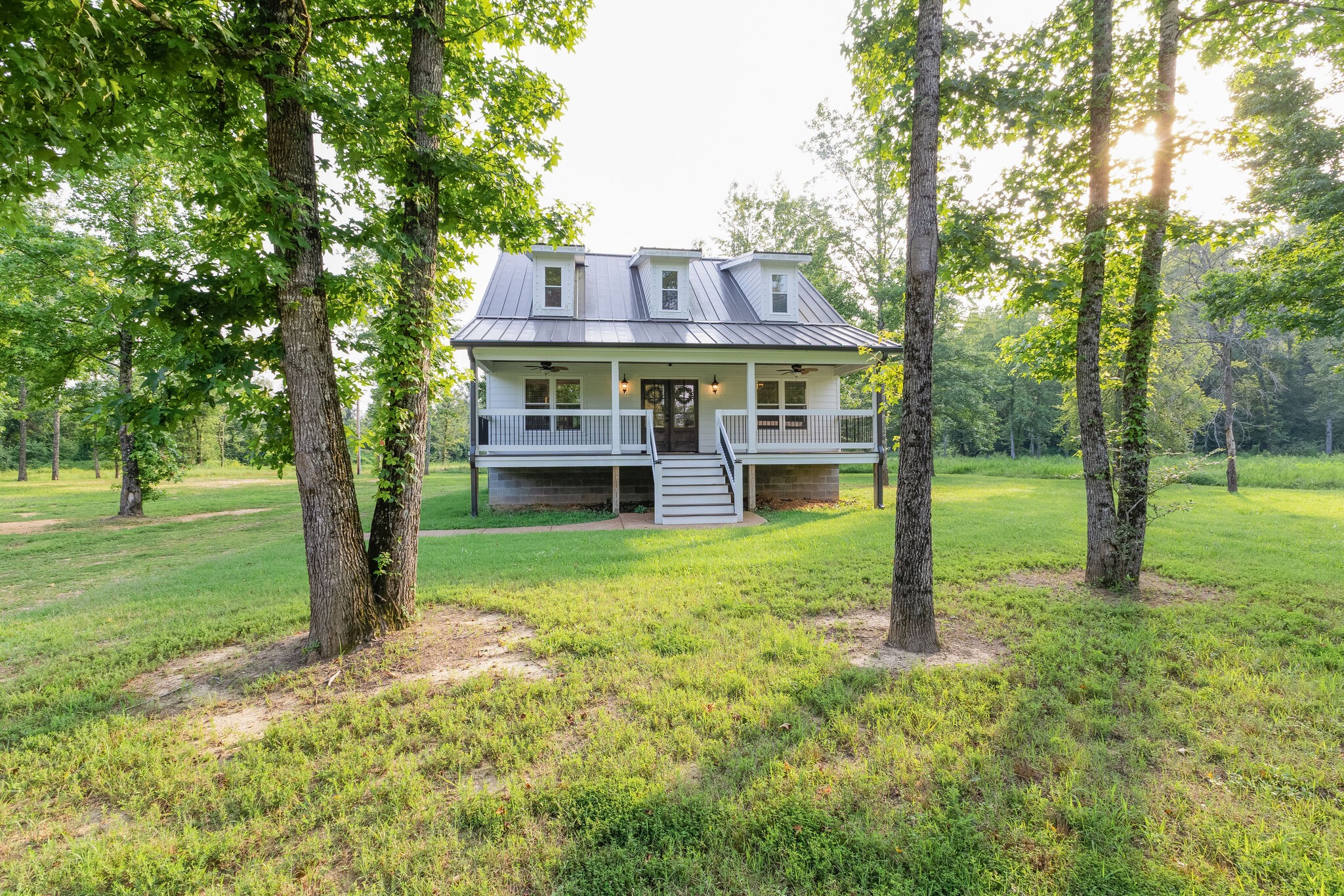 3425 Toms Creek Road Linden, TN 37096 - Photo 2 of 38 a view of a house with a backyard