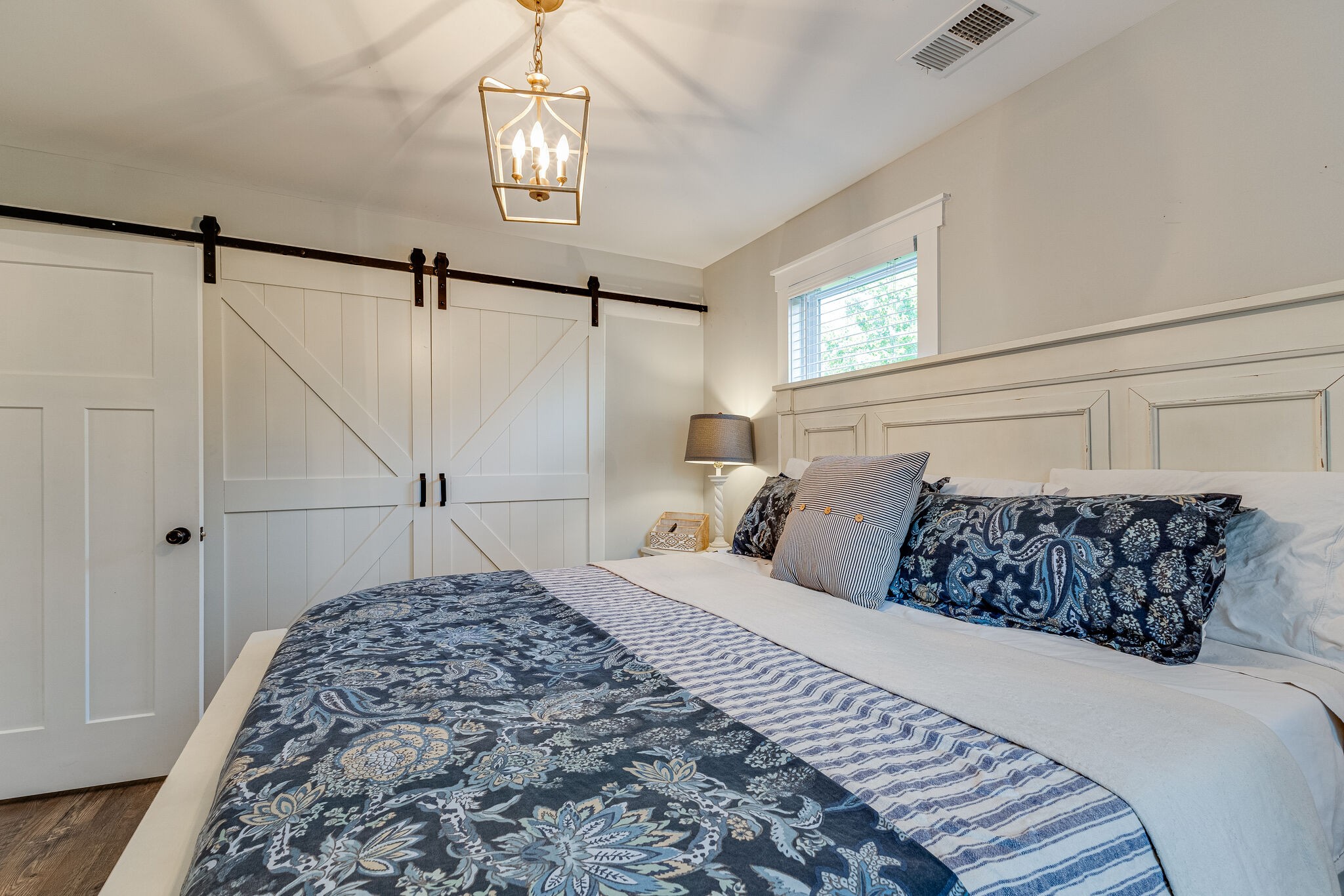 3425 Toms Creek Road Linden, TN 37096 - Photo 22 of 38 a bedroom with a large bed and a window