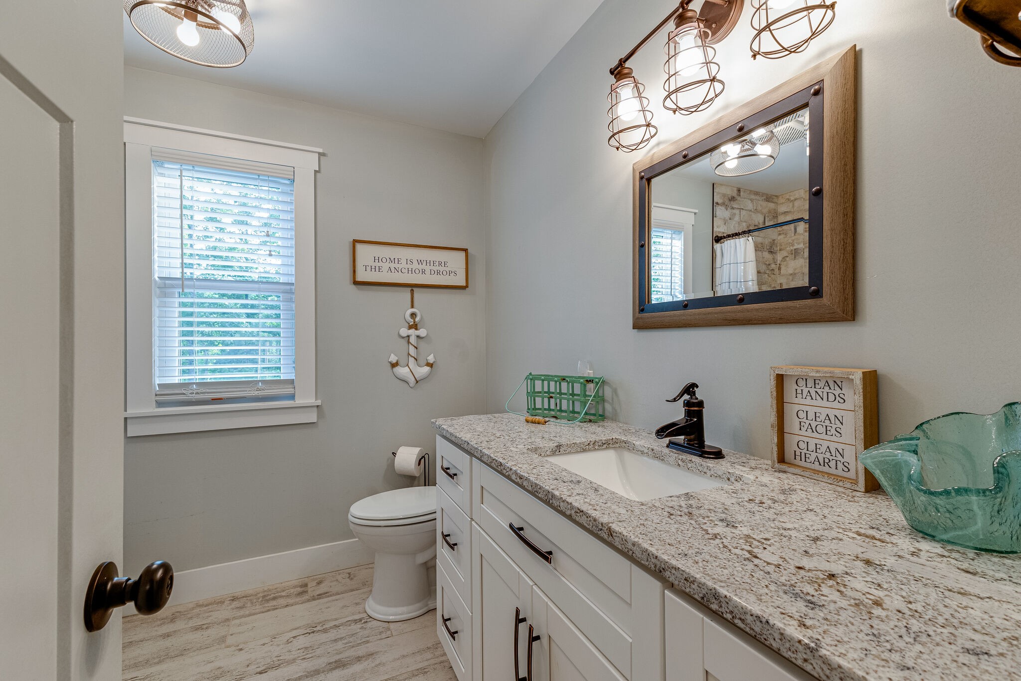 3425 Toms Creek Road Linden, TN 37096 - Photo 23 of 38 a bathroom with a granite countertop toilet sink and mirror
