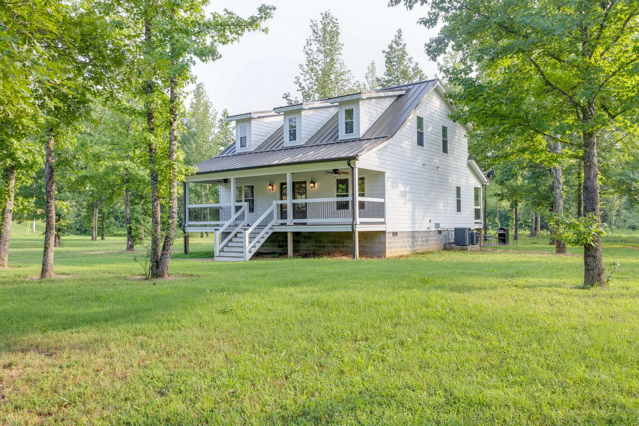 3425 Toms Creek Road Linden, TN 37096 - Photo 3 of 38 a view of a house with backyard and garden