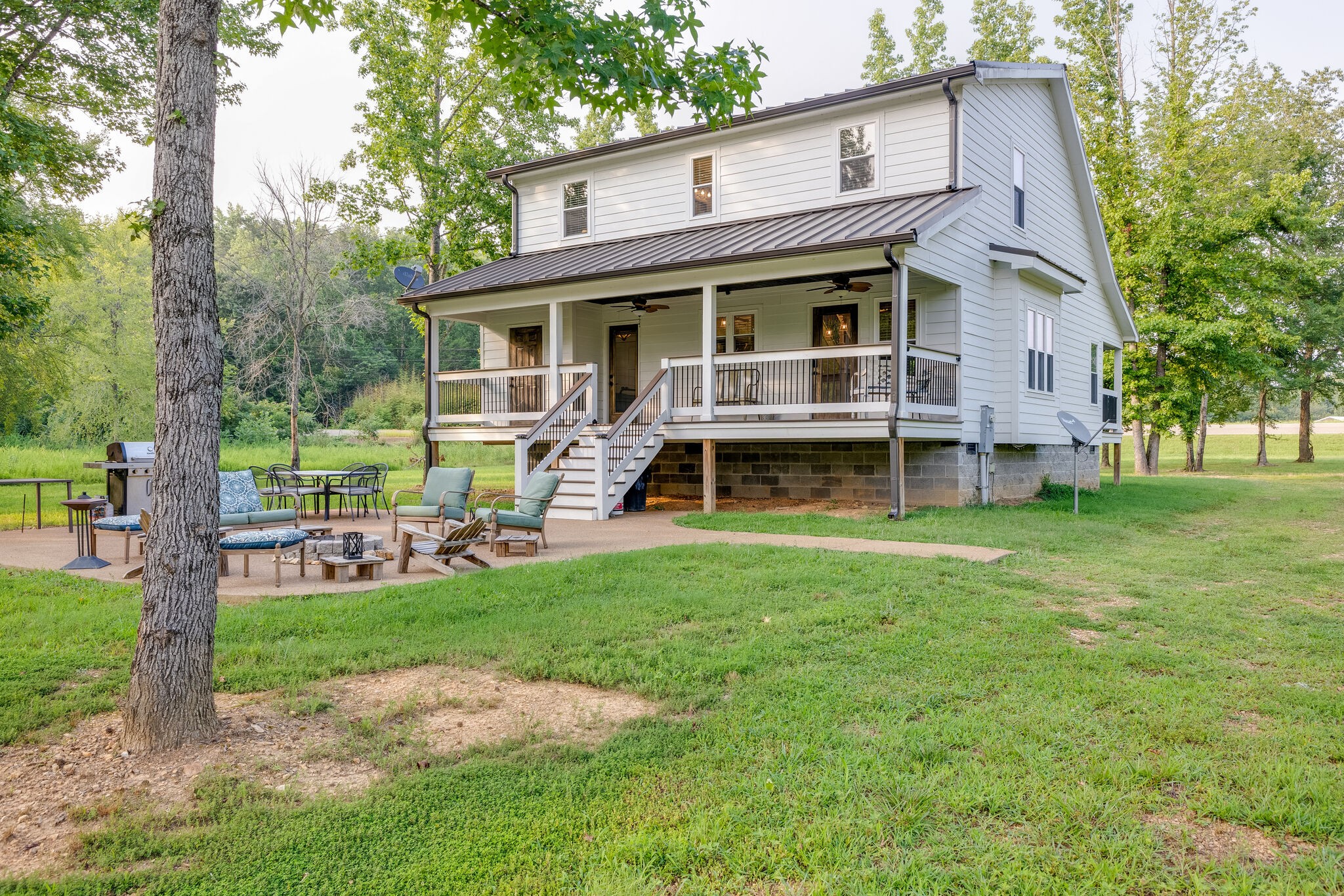 3425 Toms Creek Road Linden, TN 37096 - Photo 32 of 38 a view of a yard in front of a house with a large tree
