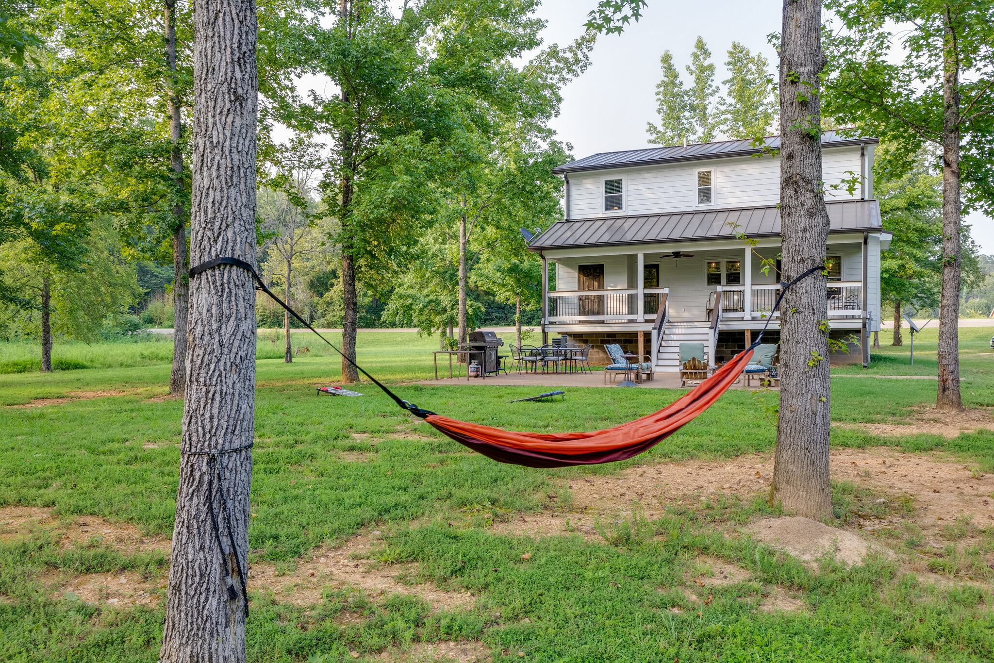 3425 Toms Creek Road Linden, TN 37096 - Photo 33 of 38 a view of a house with a backyard porch and sitting area
