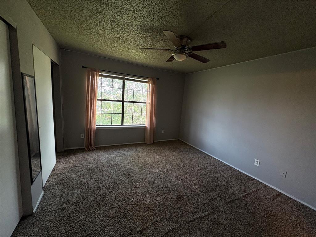 808 West Collins Street Denton, TX 76201 - Photo 11 of 17 a view of an empty room with a window