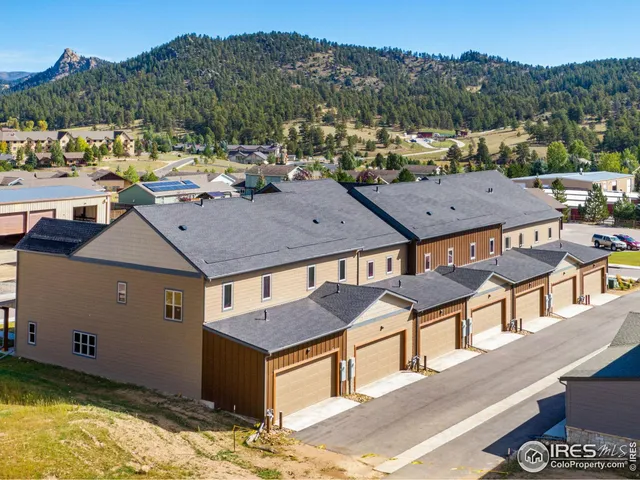 a view of a terrace with a table and chairs