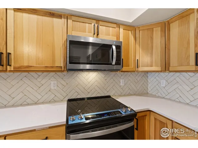 a kitchen with a stove and a microwave
