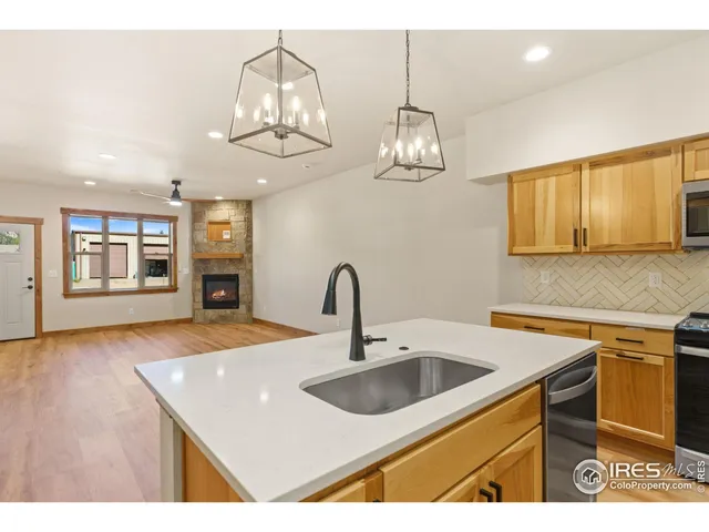 a kitchen with a sink and stove
