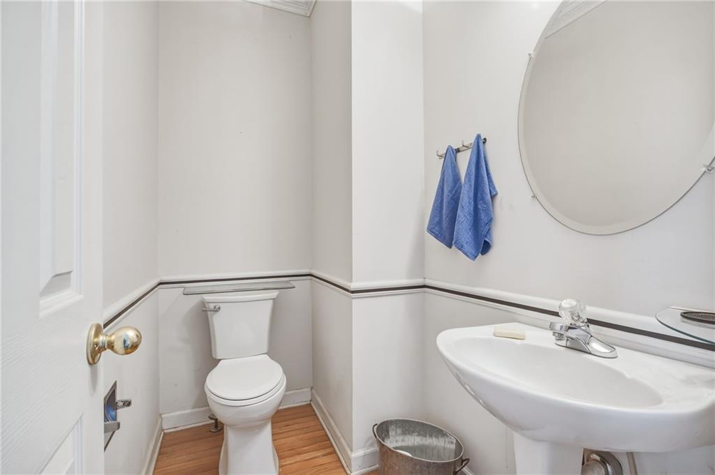 260 Manning Road Southwest, Unit 136 Marietta, GA 30064 - Photo 11 of 43 a bathroom with a sink toilet and mirror