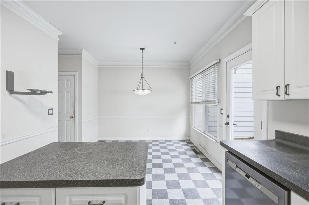 260 Manning Road Southwest, Unit 136 Marietta, GA 30064 - Photo 16 of 43 a living room with a granite countertop sink and a refrigerator