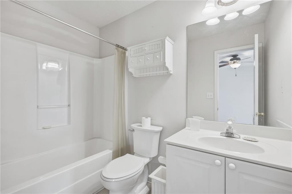 260 Manning Road Southwest, Unit 136 Marietta, GA 30064 - Photo 23 of 43 a bathroom with a sink a toilet and shower
