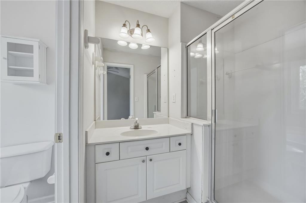 260 Manning Road Southwest, Unit 136 Marietta, GA 30064 - Photo 28 of 43 a bathroom with a sink vanity and a mirror